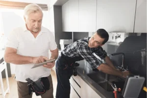 Man fixing a sink.